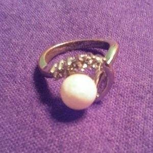 Faux metal and pearl. Size 8 women's ring.